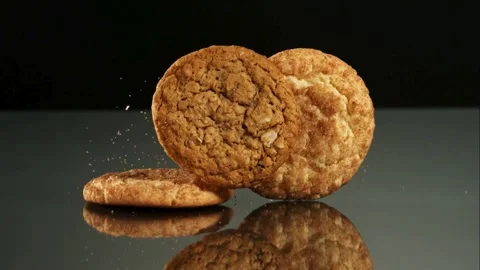 Snickerdoodle cookies falling and stacking on a table Stock Footage 326750140