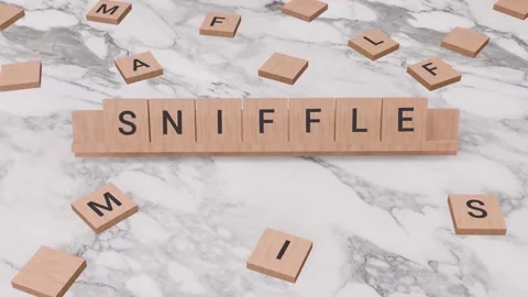 SNIFFLE word written on scrabble Stock Footage 257404836