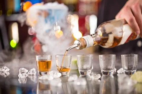 Snifters on bar desk, close-up. Stock Photos