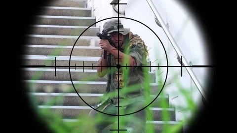 The sniper is aiming to kill the enemy through the scope Stock Footage 243194758