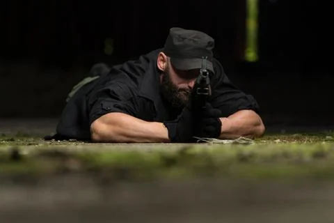 Sniper is aiming to shoot Stock Photos