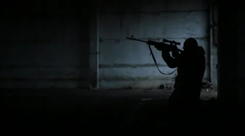 Sniper comes out of the darkness and makes 3 shots Stock Footage 44784460