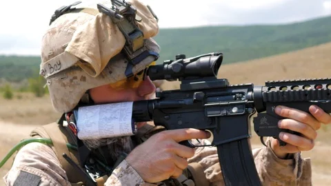 Sniper looking through the scope. Super meat boy - the inscription on the helmet Stock Footage 129134003