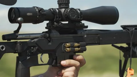 The sniper is reloading his rifle. Close-up Stock Footage 246065569