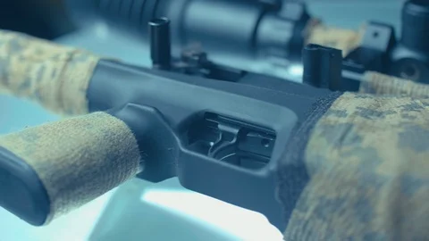Sniper rifle on CSI expert table - close up Stock Footage 86413440
