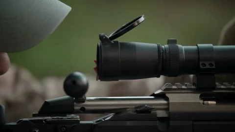 Sniper rifle. Sniper adjusts the scope. Video stock 107411575