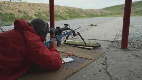 A sniper shoots at a target in a high-precision shooting competition Stock Footage 243798193