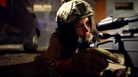 The sniper takes aim with a rifle while lying on the concrete floor, the dark Vídeo Stock 296375649