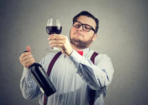 Snobby wine expert exploring drink Stock Photos