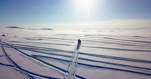 Snomobiling in the tundra. Stock Footage 99642124
