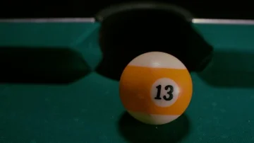 Snooker ball with number thirteen get into the billiard pocket Stock Footage 85899043