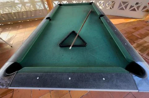 Snooker billiard table, cue on the table, playroom Stock Photos
