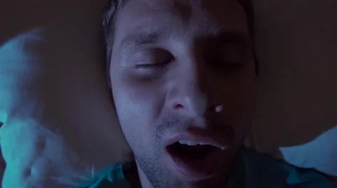 Snoring man in bed at home Stock Footage 60056856