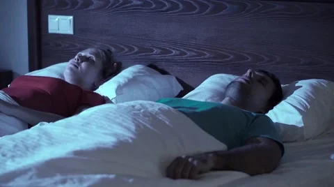 Snoring man. Couple in bed Stock Footage 60056862