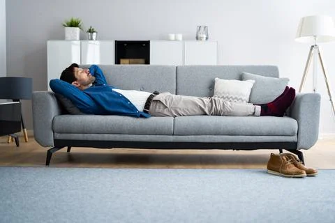 Snoring Sleeping Man On Couch Stock Photos