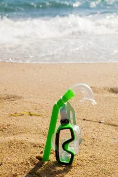 Snorkel and mask in sand Stock Photos