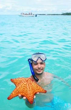 Snorkel with starfish Stock Photos