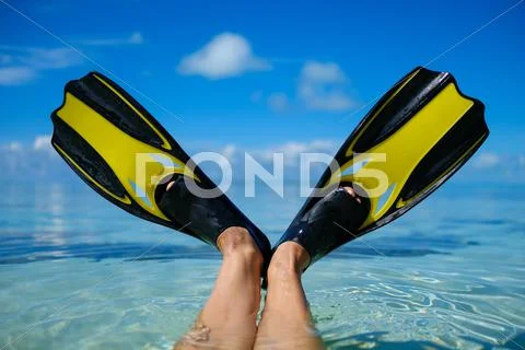 Snorkeler relaxing on the beach Stock Photos