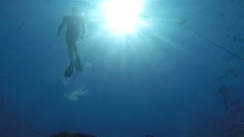 Snorkeling, Dramatic view from below Stock Footage 73817988