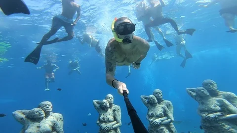 Snorkelling with underwater statues Stock Footage 122870344