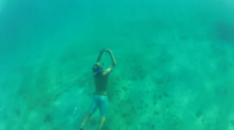 Snorkler surfaces Stock Footage 42693741