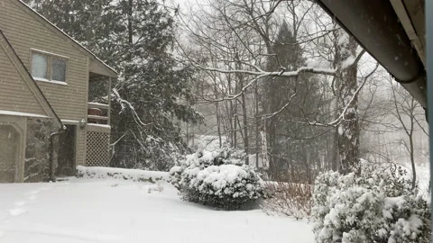 Snow Accumulation during Winter Snowstorm outside door of rural Connecticut home Stock Footage 150454897