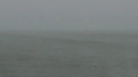 Snow and big waves as hurricane force winds blow Stock Footage 70673787