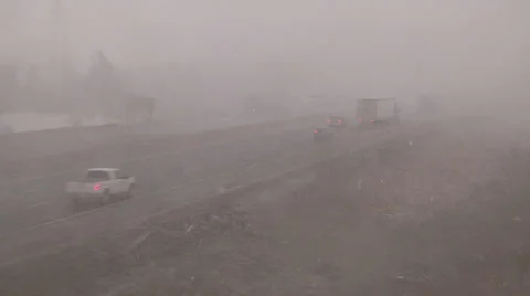 Snow and blowing snow with blizzard conditions on highway v3 Stock Footage 36596399