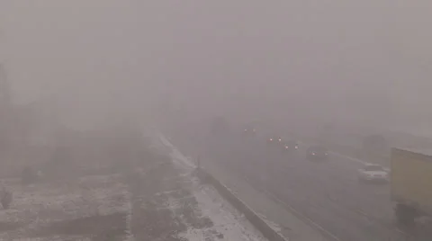 Snow and blowing snow with blizzard conditions on highway v12 Stock Footage 36596744