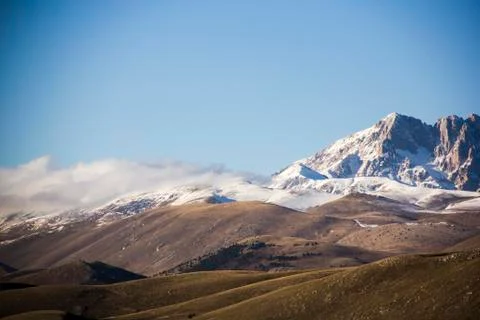 Snow and cloud capped mountains in Italy Stock Photos