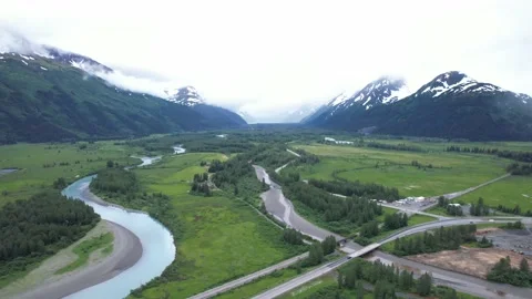 Snow and Cloud Covered Mountains in Alaska Stock Footage 217831107