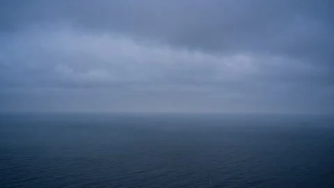 Snow and clouds over the sea, bad weather. Stock Footage 229580796