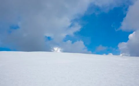 Snow and clouds Stock Photos