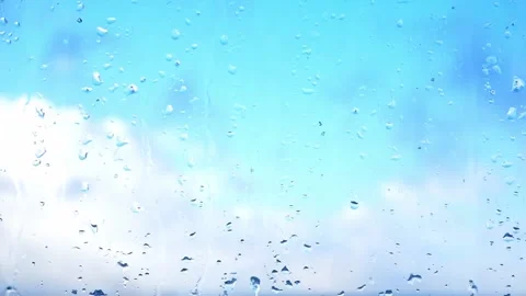 Snow and rain fall on the window. Drops are flowing on glass. Stock Footage 180448565