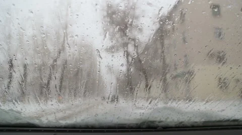 Snow and rain flows over the windshield of the car Stock Footage 57511400