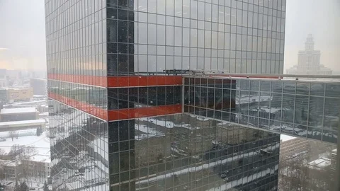 Snow and reflection of a tall building Video stock 69986801