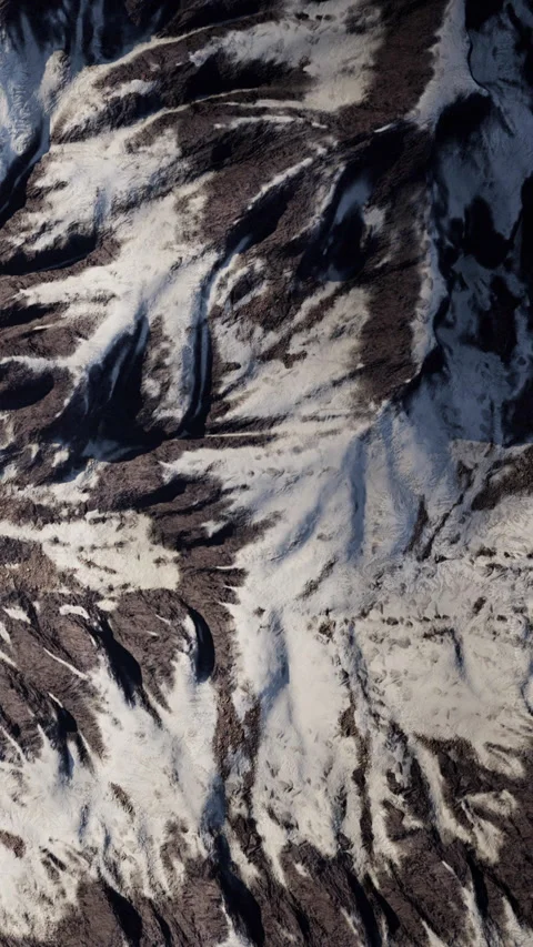 Snow and rock patterns on mountain surface in daytime Stock Footage 345008807