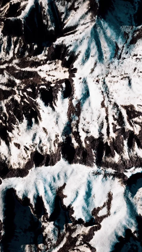 Snow and rock patterns on a mountain during winter Stock Footage 345010397