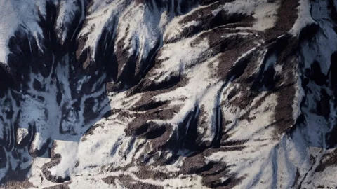 Snow and rock patterns in mountain area from high view point during daytime Stock Footage 345011410