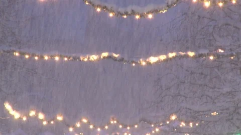 Snow and string lights Stock Footage 74095235