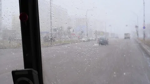 Snow and wind in the city in the spring afternoon on the background of houses an Stock-Footage 108849652