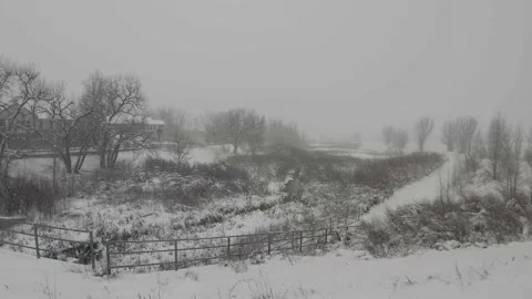Snow and Wind Over A Small Stream Stock Footage 230539943