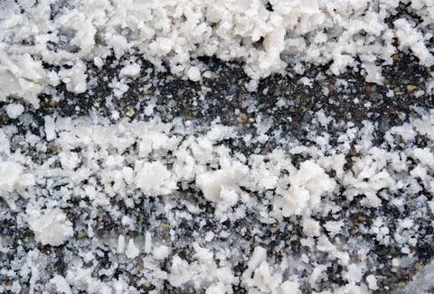 Snow on asphalt Stock Photos