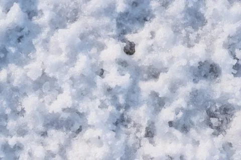 Snow as background, closeup view. Winter weather. Spring grainy blue snow Stock Photos