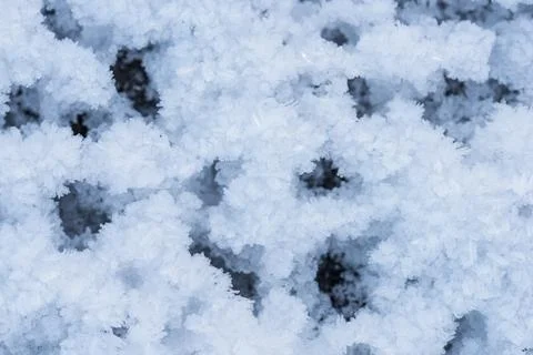 Snow as background, closeup view. Winter weather. Spring grainy blue snow Foto stock