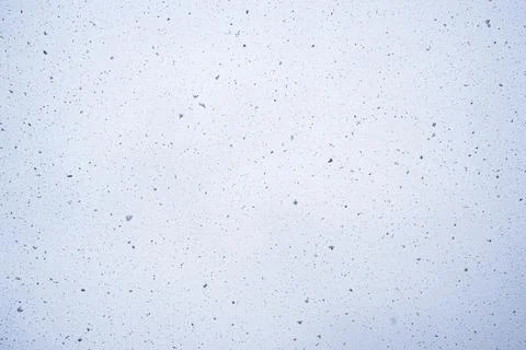 Snow on the background of the sky. Falling snow. Snowfall. Stock Photos