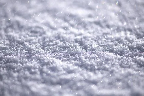 Snow background with textured surface. Snow texture in cold pattern. White sn Stock Photos