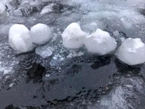 Snow balls on the ground. Stock Photos