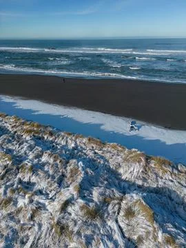 Snow on the beach grass Stock Photos