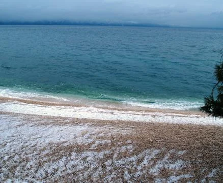 Snow on beach 库存照片